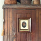 Antique oil painting of woman in frame