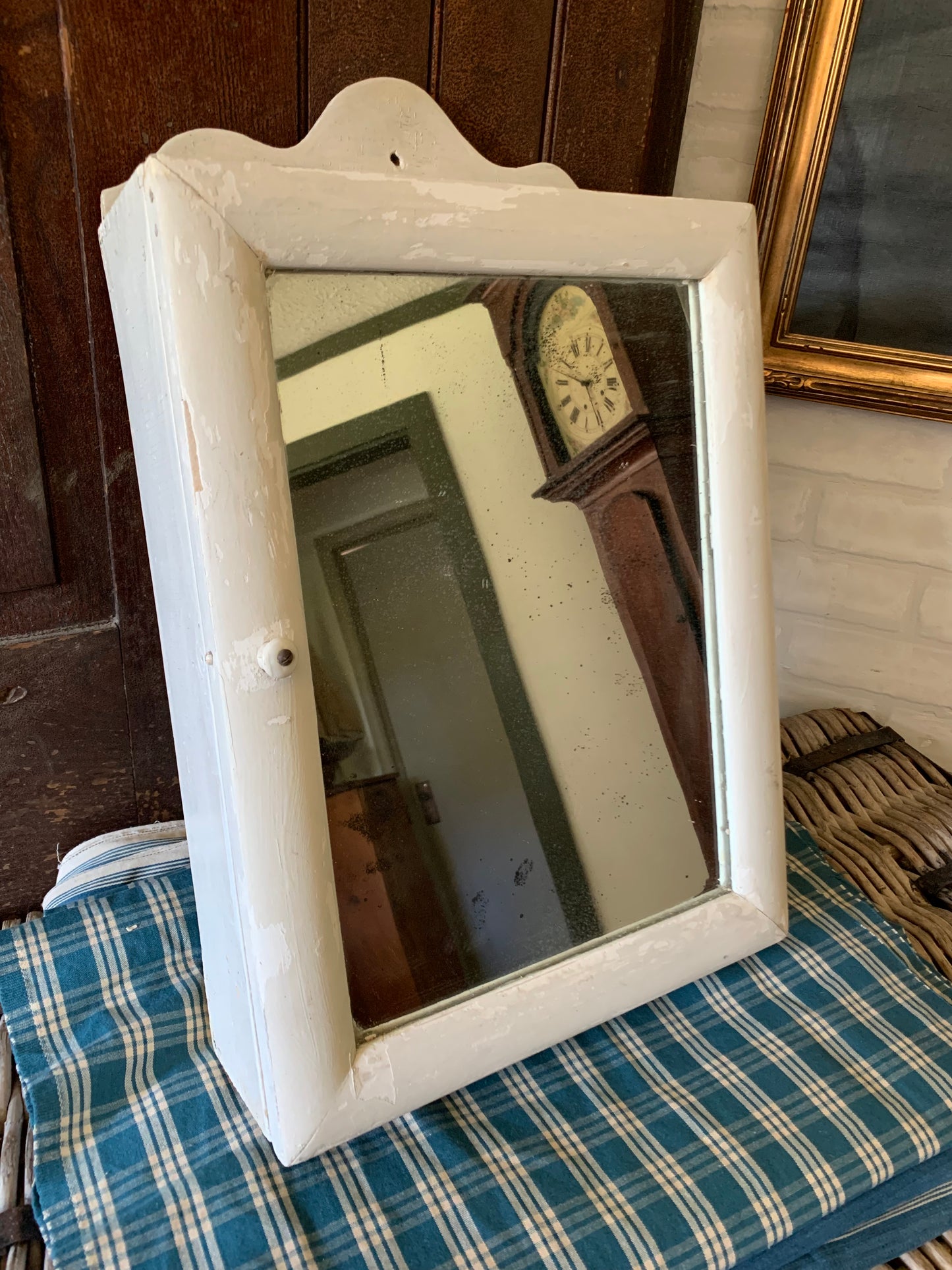 Antique small scalloped mirrored cabinet